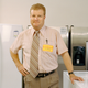 A stressed-looking appliance salesman